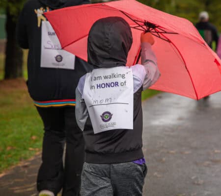 Child walks at the Circle of Victory walk