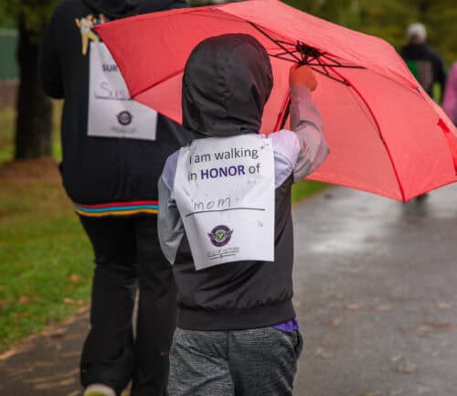 Child walks at the Circle of Victory walk