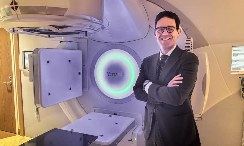 Doctor Paravati standing in front of. The radiology machine