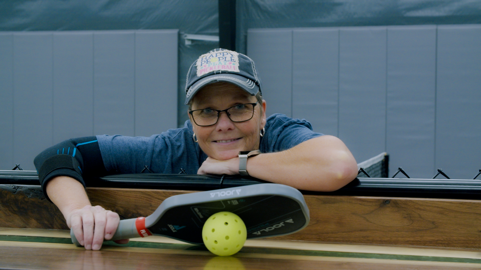 Julie Michael with pickleball paddle and ball