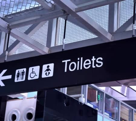 Toilet signs in airport rest room