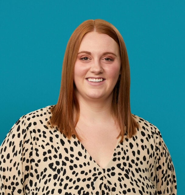 Professional headshot of Aleesha Schafers, PA-C in leopard print blouse against teal background