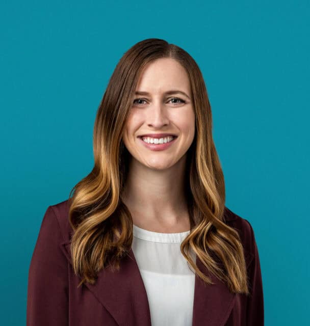 Professional headshot of Alyssa M. Goodwin, APRN-CNP in burgundy blazer smiling