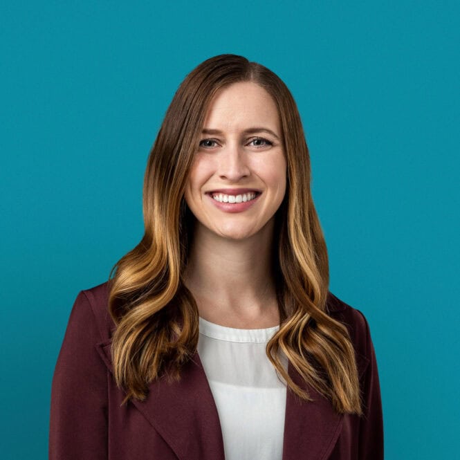Professional headshot of Alyssa M. Goodwin, APRN-CNP in burgundy blazer smiling