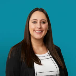 Professional headshot of Alyssa R. Wetzel, APRN-CNP, smiling in business attire against teal background