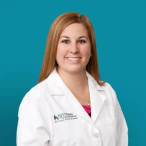 Professional headshot of Angela M. Prickett, APRN-CNP in white medical coat