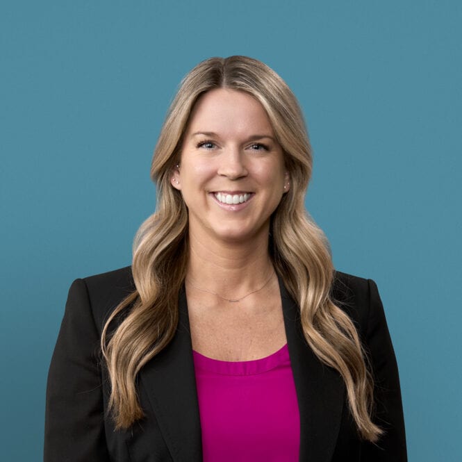 Professional headshot of Anna Bergman, APRN-CNP in black blazer with pink top
