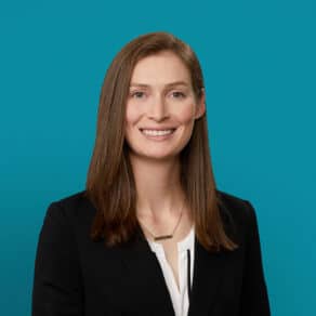Professional headshot of Annabeth Barry, PA-C, smiling in dark blazer against teal background