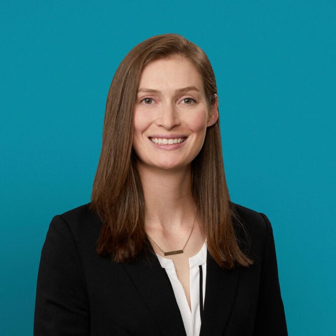 Professional headshot of Annabeth Barry, PA-C, smiling in dark blazer against teal background