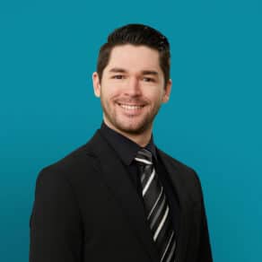 Professional headshot of Charles Swafford, APRN-CNP in dark suit against teal background