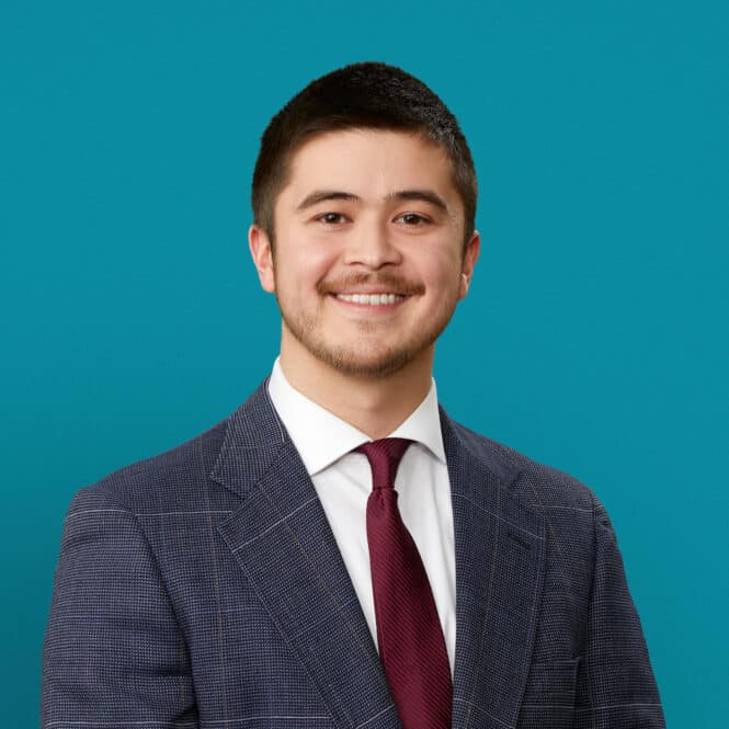 Professional headshot of Chris Wharton, PA-C in suit and tie against teal background