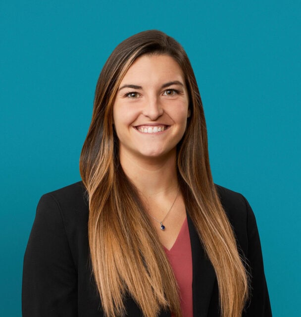Professional headshot of Gabrielle LaSala, PA-C in black blazer against teal background