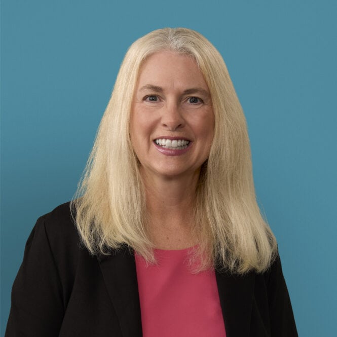 Professional headshot of Gail Griffith, RN, smiling in black blazer and pink top.