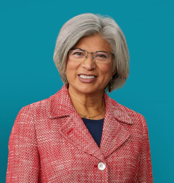 Professional headshot of Gayatri Acebal, PA-C in red blazer smiling at camera
