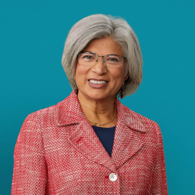 Professional headshot of Gayatri Acebal, PA-C in red blazer smiling at camera