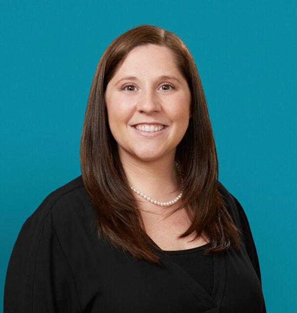 Professional headshot of Jennifer R. Roberts, PA-C, smiling in black top with pearl necklace