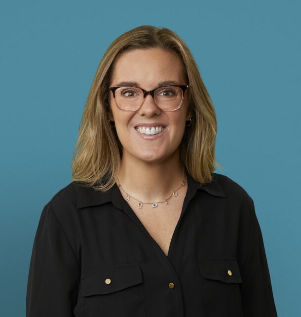 Professional headshot of Jeri Downey, APRN-CNP, smiling woman with glasses and black blouse