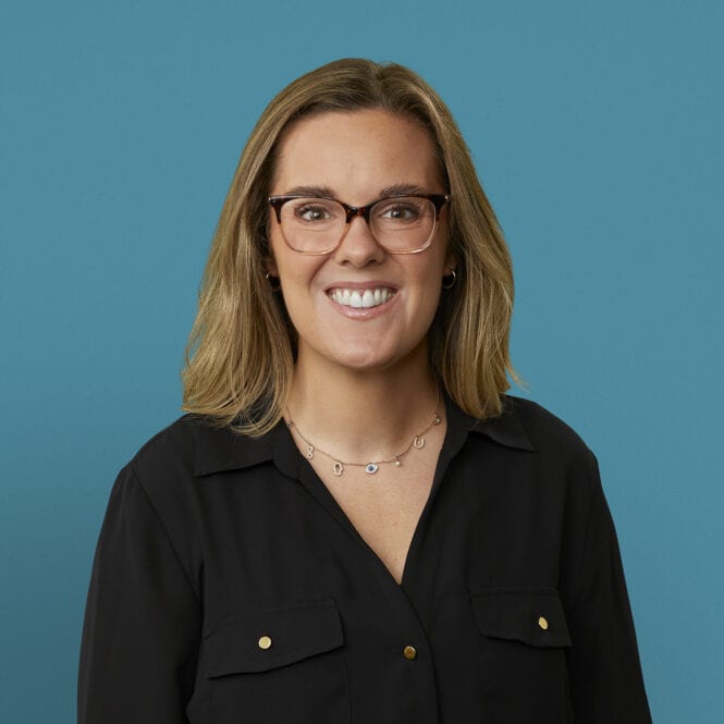 Professional headshot of Jeri Downey, APRN-CNP, smiling woman with glasses and black blouse