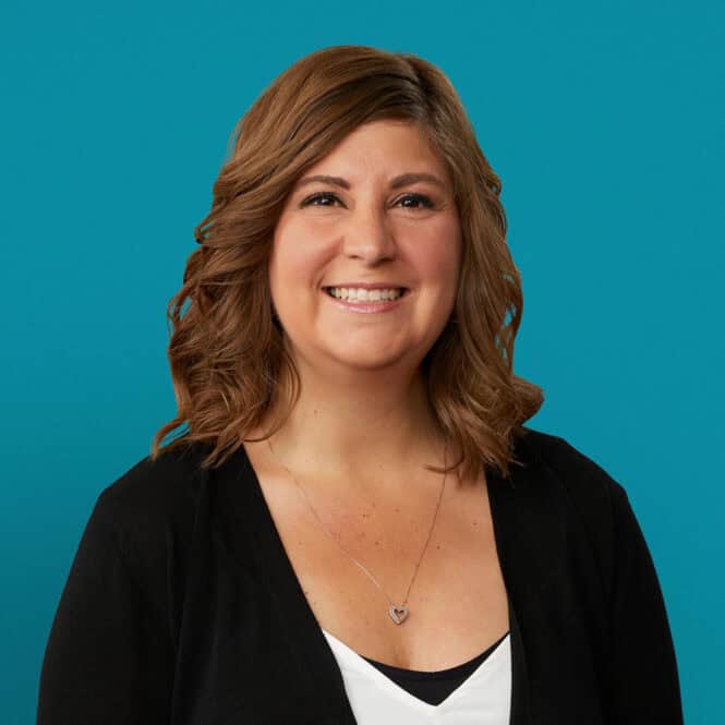 Professional headshot of Jessica Cooper, APRN-CNP, smiling in black cardigan against teal background