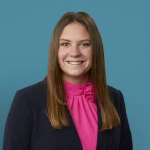 Professional headshot of Karley A. Schlensker, PA-C in navy blazer and pink blouse