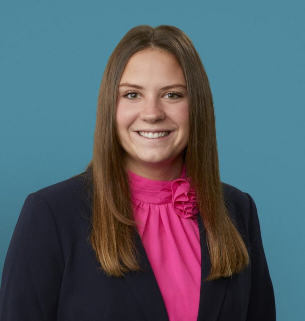 Professional headshot of Karley A. Schlensker, PA-C in navy blazer and pink blouse
