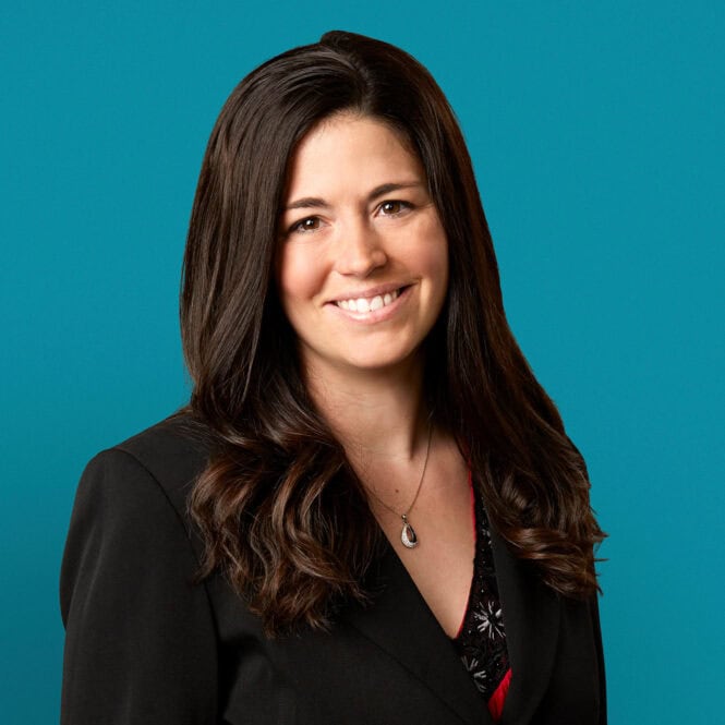 Professional headshot of Laura A. Busteed, APRN-CNP against teal background