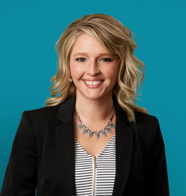 Professional headshot of Lauren A. Stroud, APRN-CNP in black blazer smiling at camera