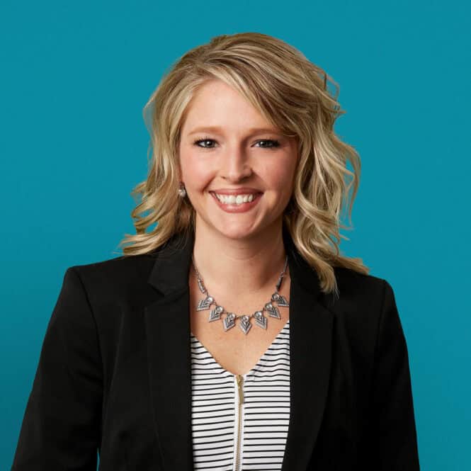 Professional headshot of Lauren A. Stroud, APRN-CNP in black blazer smiling at camera