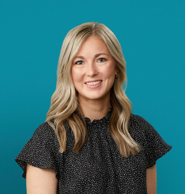 Professional headshot of Macey A. Gross, PA-C in polka dot blouse against teal background