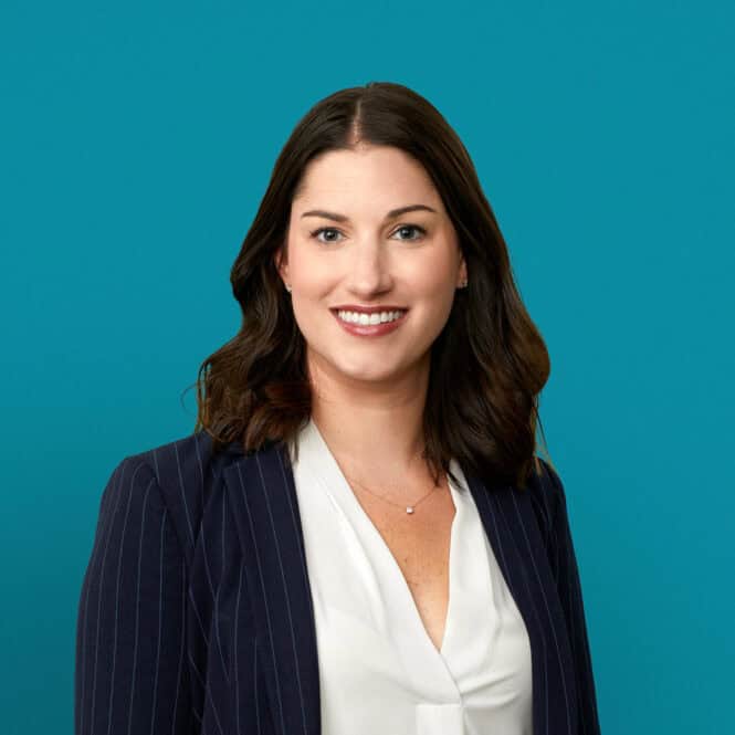 Professional headshot of Michelle N. Bonnet, MD in navy blazer against teal background
