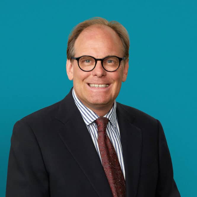 Professional headshot of Nathan L. Beebe, MD wearing glasses and business suit