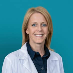 Professional headshot of Raenell J. Poynter, APRN-CNP in white medical coat