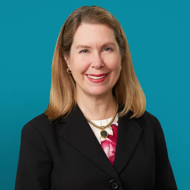 Professional headshot of Rebecca J. Paessun, MD in black blazer against teal background