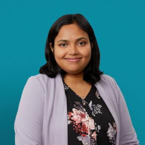 Professional headshot of Dr. Srivani Chunchulu in floral top and lavender cardigan.