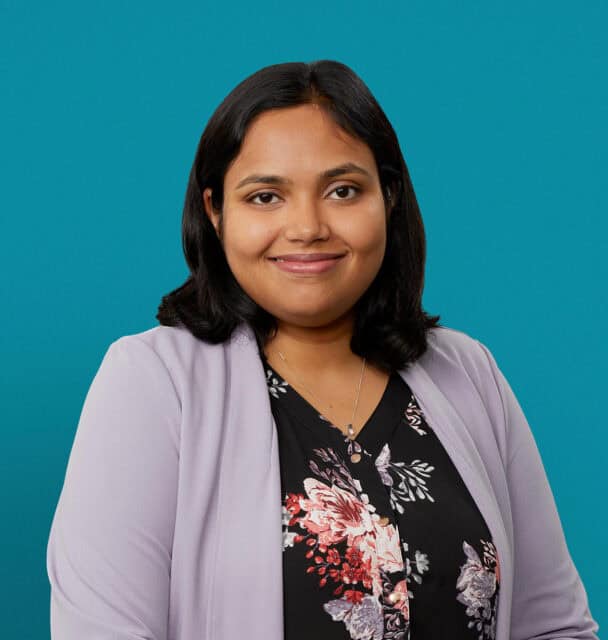 Professional headshot of Dr. Srivani Chunchulu in floral top and lavender cardigan.