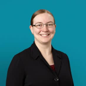 Professional headshot of Dr. Stefanie K. Lewis wearing glasses and black blazer