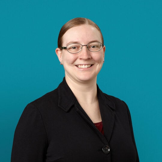 Professional headshot of Dr. Stefanie K. Lewis wearing glasses and black blazer