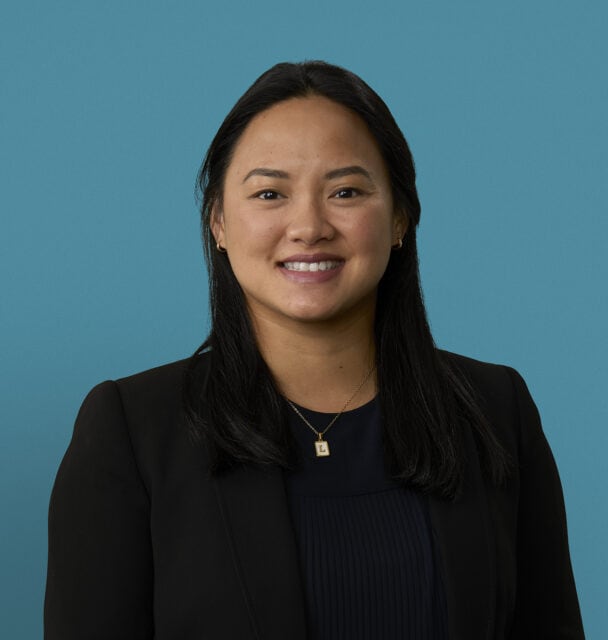 Professional headshot of Tracy T. Phan, DO smiling in dark business attire
