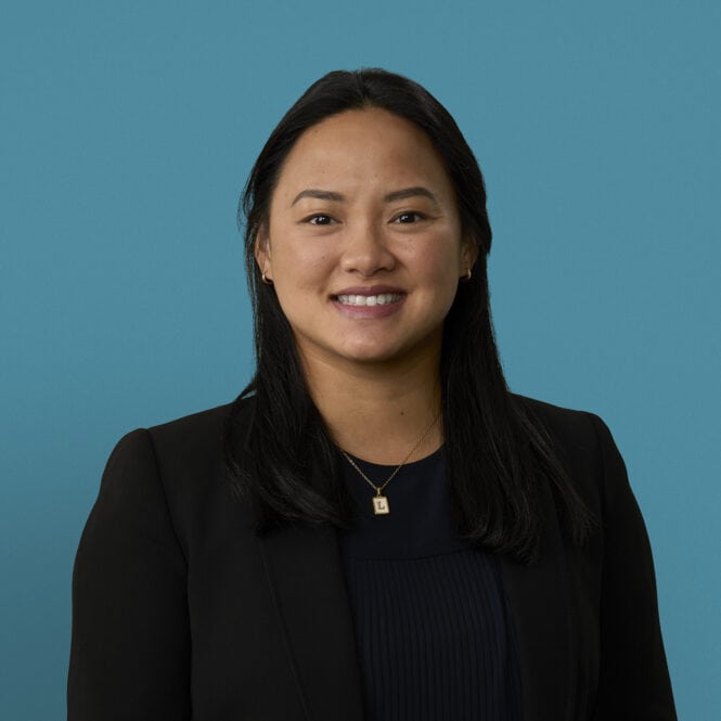 Professional headshot of Tracy T. Phan, DO smiling in dark business attire