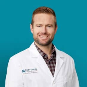 Professional headshot of William T. Allnutt, APRN-CNP in white Kettering Health coat