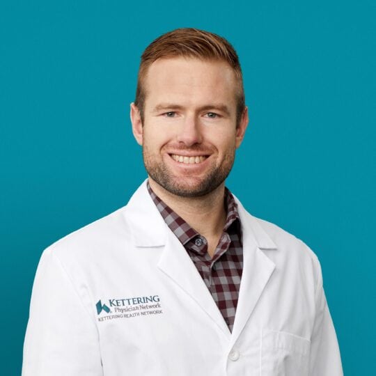 Professional headshot of William T. Allnutt, APRN-CNP in white Kettering Health coat