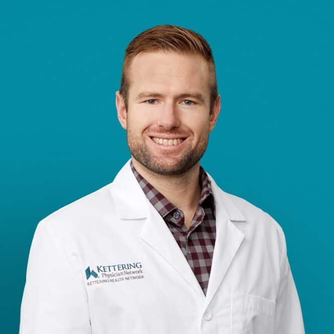 Professional headshot of William T. Allnutt, APRN-CNP in white Kettering Health coat