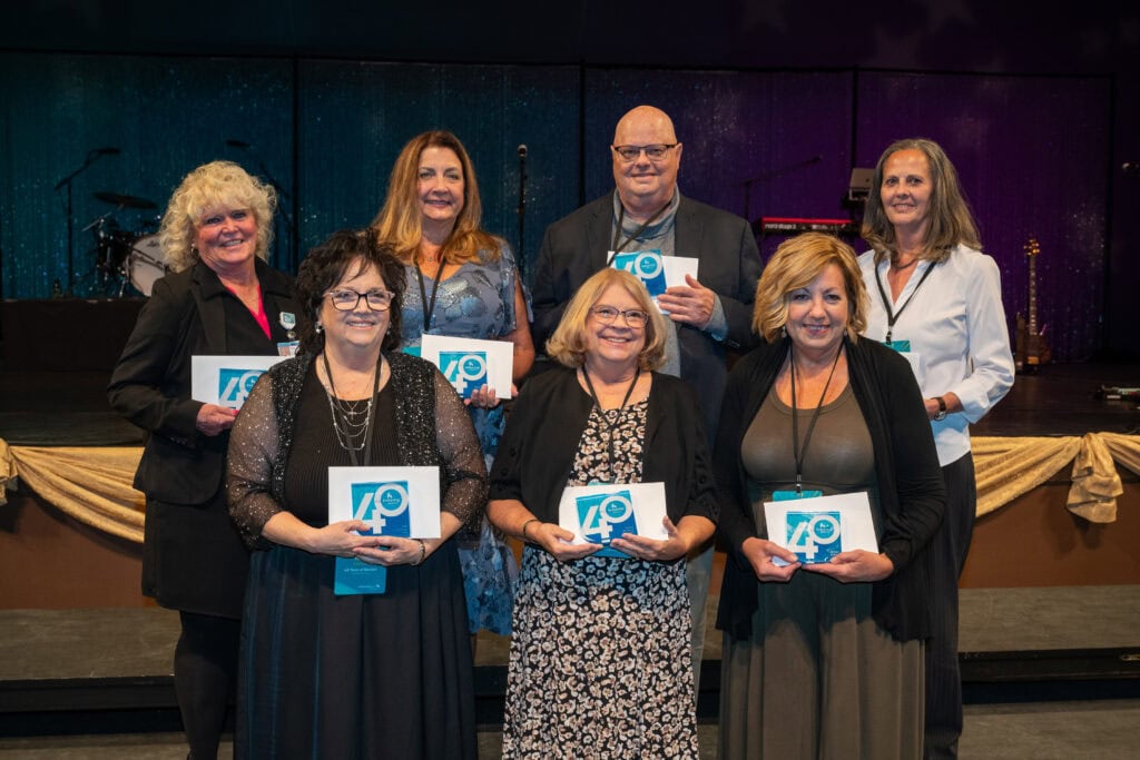 40-year employees holding their awards