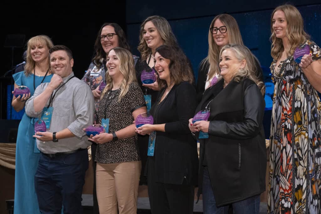 Leader's Choice Award recipients holding their awards