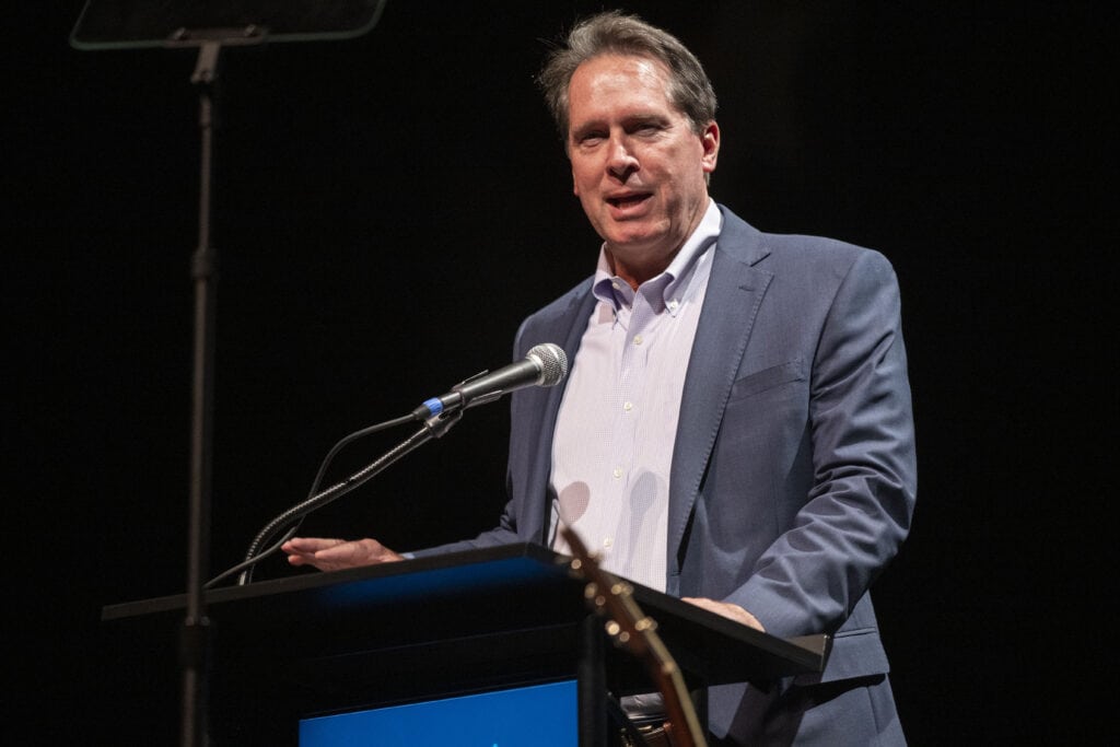 Mike Gentry speaking at a podium