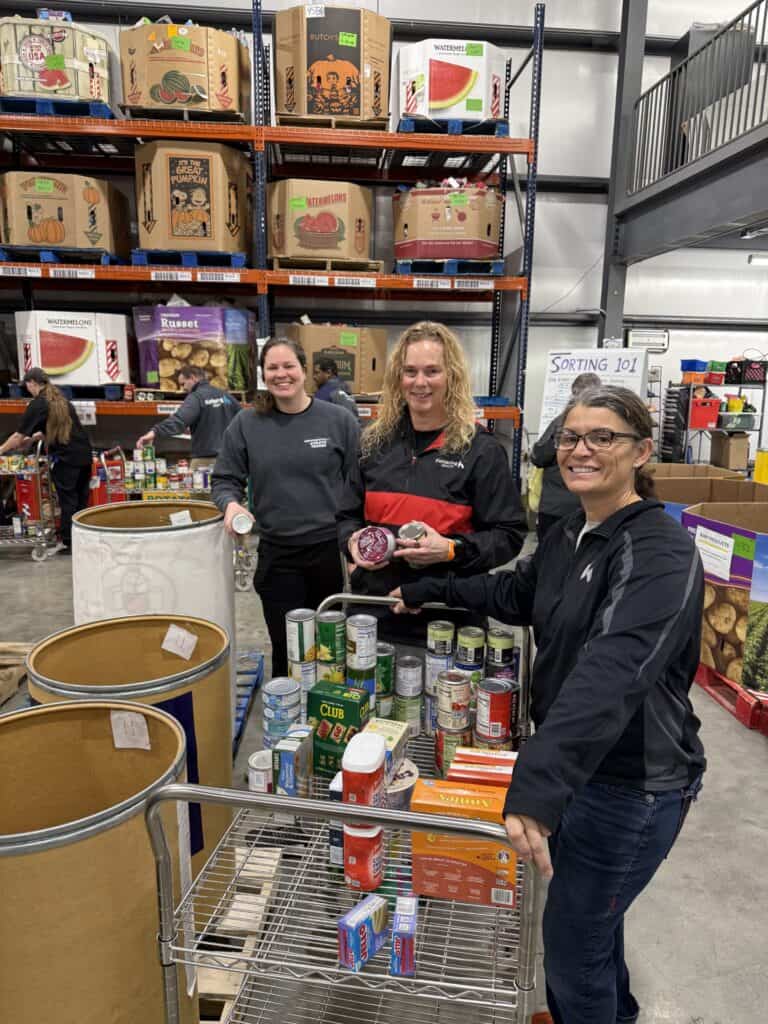 Sports Medicine staff sorting food at The Foodbank