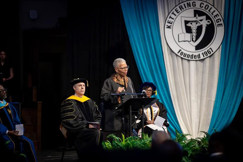 A woman speaking at a podium